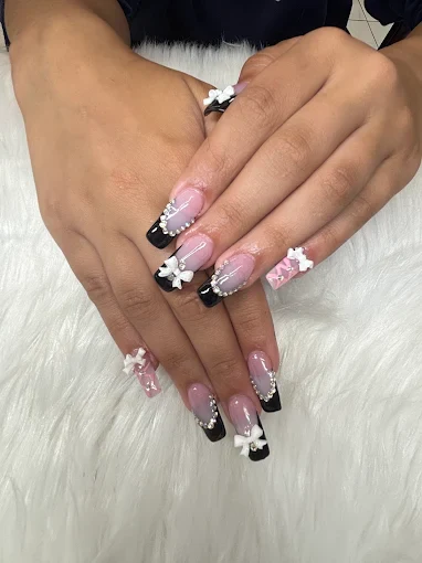 Blush sculpted nails with black French tips and floral details by Top 10 Nails Spa