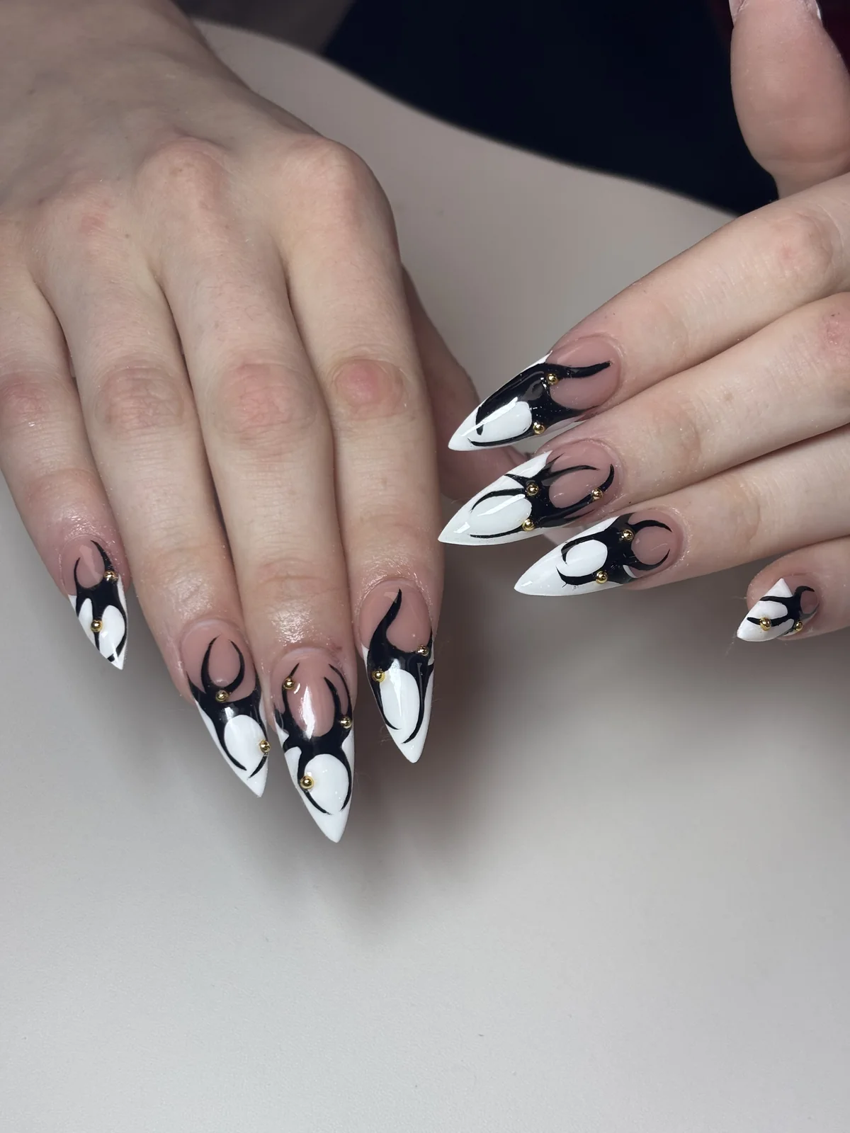Black and white sculpted swirl nail art by Top Ten Nails Spa
