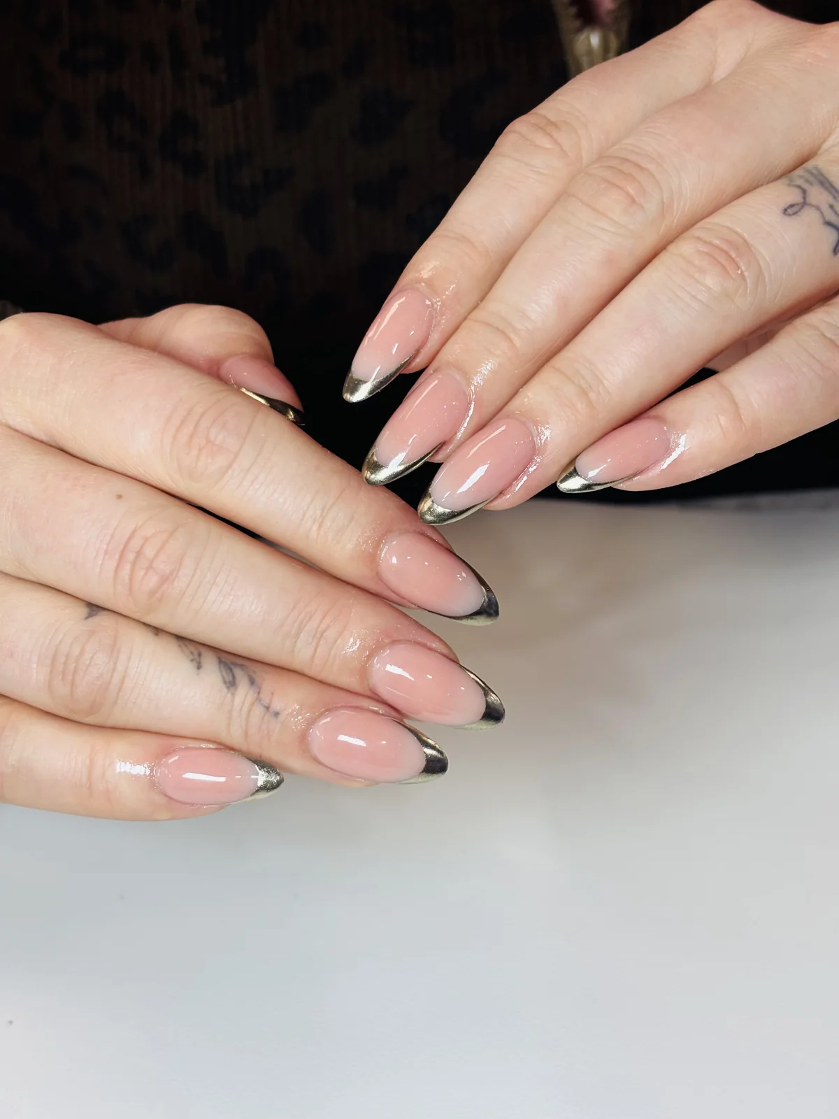 Soft nude French almond manicure by Top Ten Nails Spa