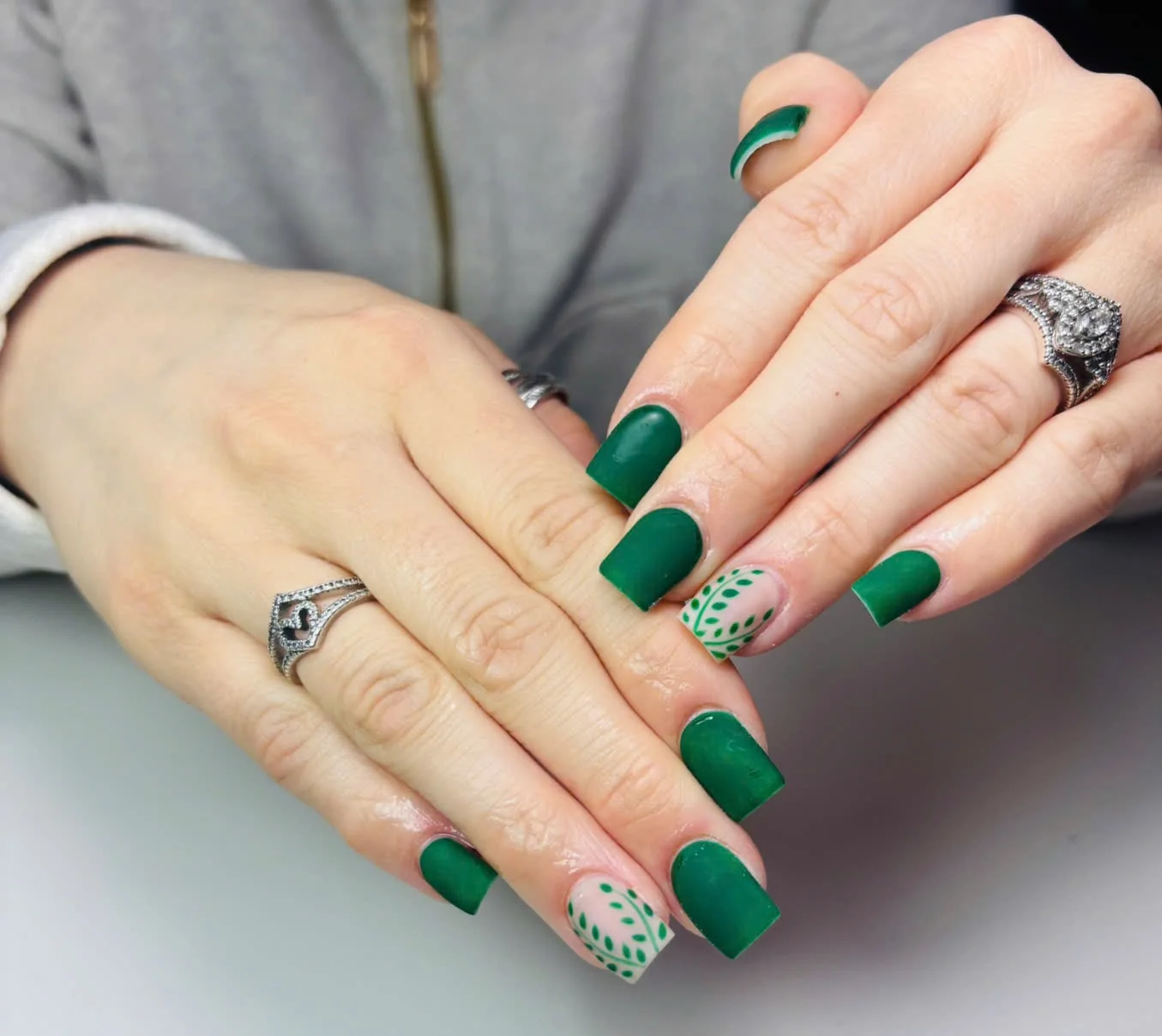 Emerald green square nails with botanical accent art by Top Ten Nails Spa